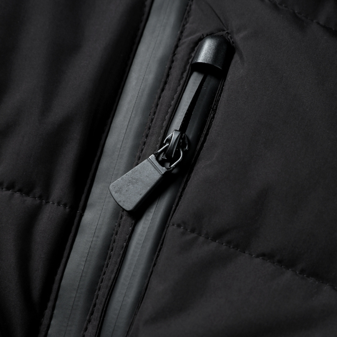 Black quilted puffer jacket zip pocket with slider and zipper pull