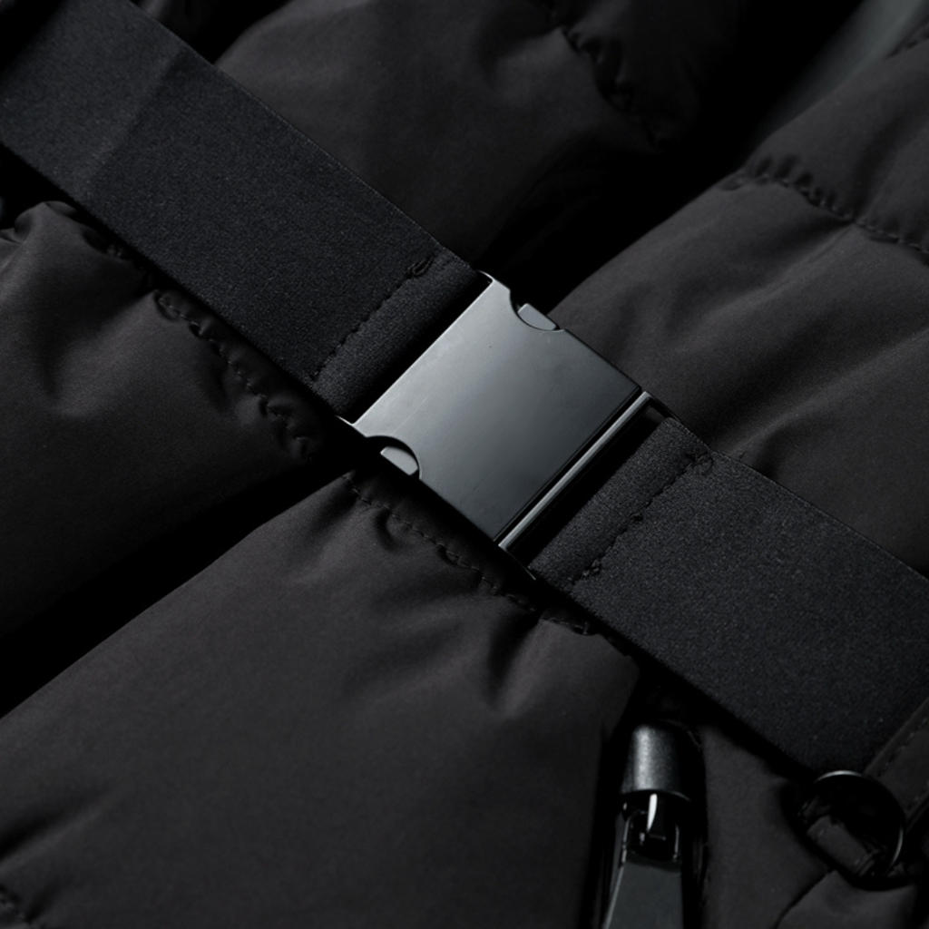 Black puffer jacket zipper with fabric tab and snap detail