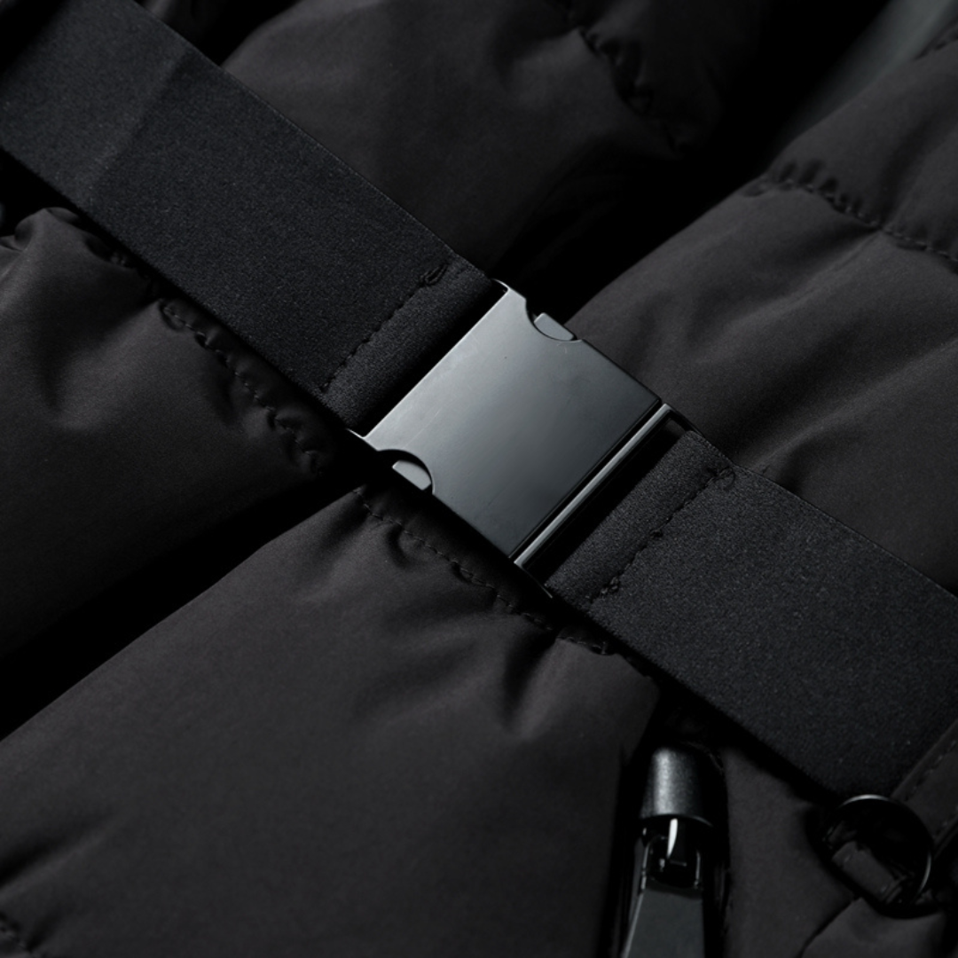 Black puffer jacket zipper with fabric tab and snap detail