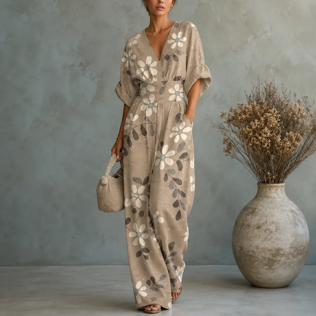 Women's floral V-neck wide-leg jumpsuit with cinched waist and pockets, taupe.