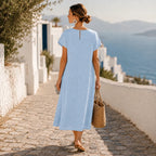 Powder blue short-sleeve midi dress with button front and flowing overlay