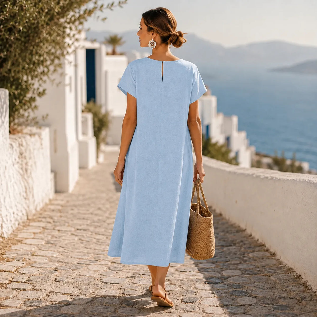 Powder blue short-sleeve midi dress with button front and flowing overlay