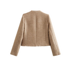 Beige collarless tweed jacket back view, cropped length, long sleeves