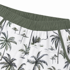 Palm-print swim shorts with green elastic waistband and side trim