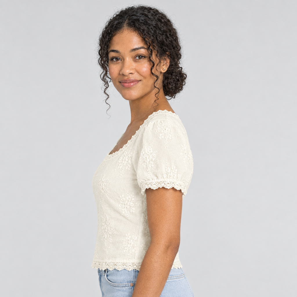 Cream lace tee side view with short puff sleeve and scalloped neckline