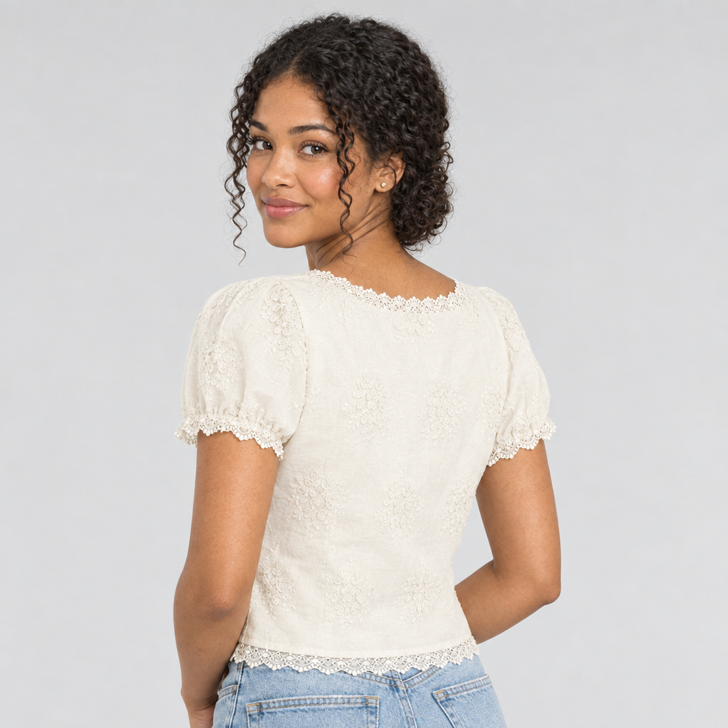 Cream lace tee back view with rounded neckline and scalloped hem