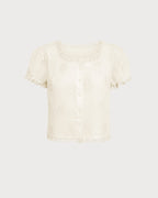 Cream lace square-neck tee, short puff sleeves, button front, scalloped edges