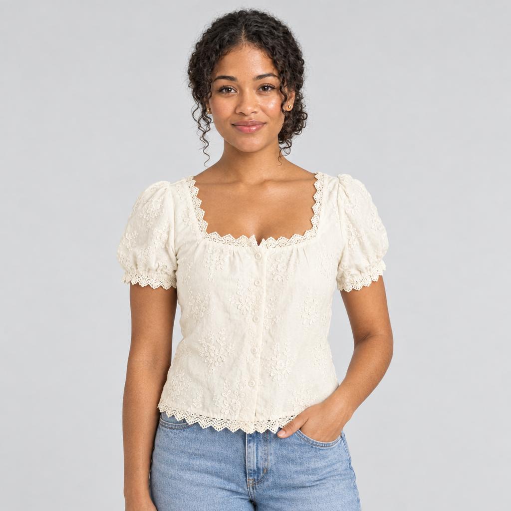 Cream square-neck lace tee on model with puff sleeves, styled with light blue jeans
