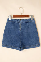 Blue denim mini skort front view, functional pockets and center button placket