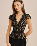 Black floral lace blouse with V-neck, short sleeves, fitted peplum silhouette