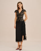Black lace V-neck blouse with short sleeves and side tie detail at waist