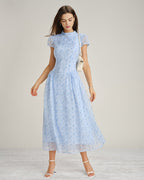 Blue floral chiffon maxi dress with mock neck, short sleeves, gathered waist