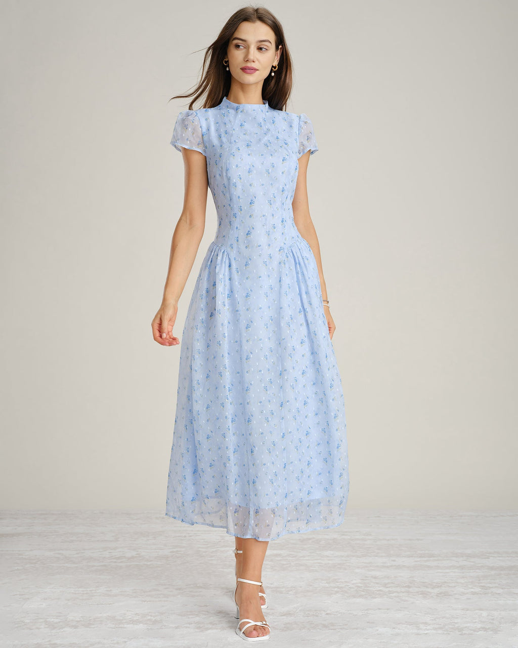 Blue floral chiffon maxi dress with mock neck and short sleeves, gathered tiered skirt