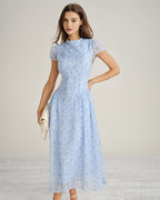 Blue floral chiffon maxi dress with mock neck, short sleeves, cinched waist