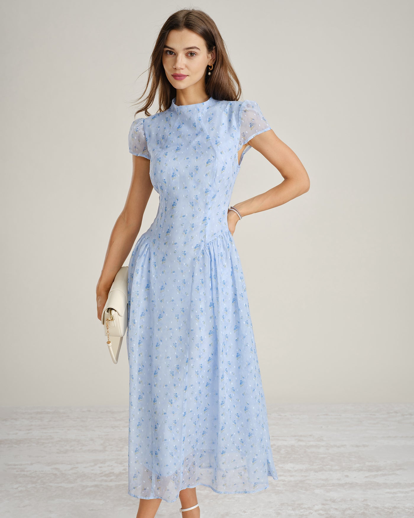 Blue floral chiffon maxi dress with mock neck, short sleeves, cinched waist