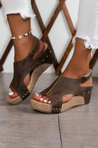 Chestnut wedge sandals with star charm ankle bracelet, studded straps, open toe