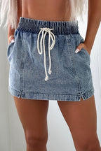 Dusk blue denim shorts with elastic waist and white drawstring, mid-length front view