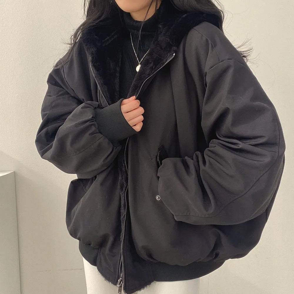 Women’s winter coat, black zip-front jacket with hood and two hand pockets