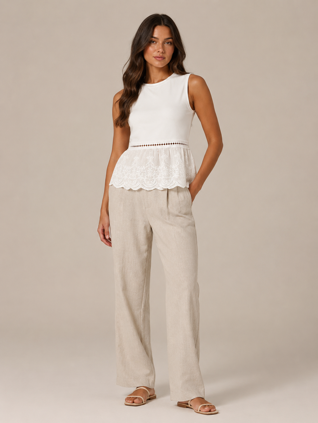 Women's white lace peplum tank top with lace hem and beige wide-leg linen pants