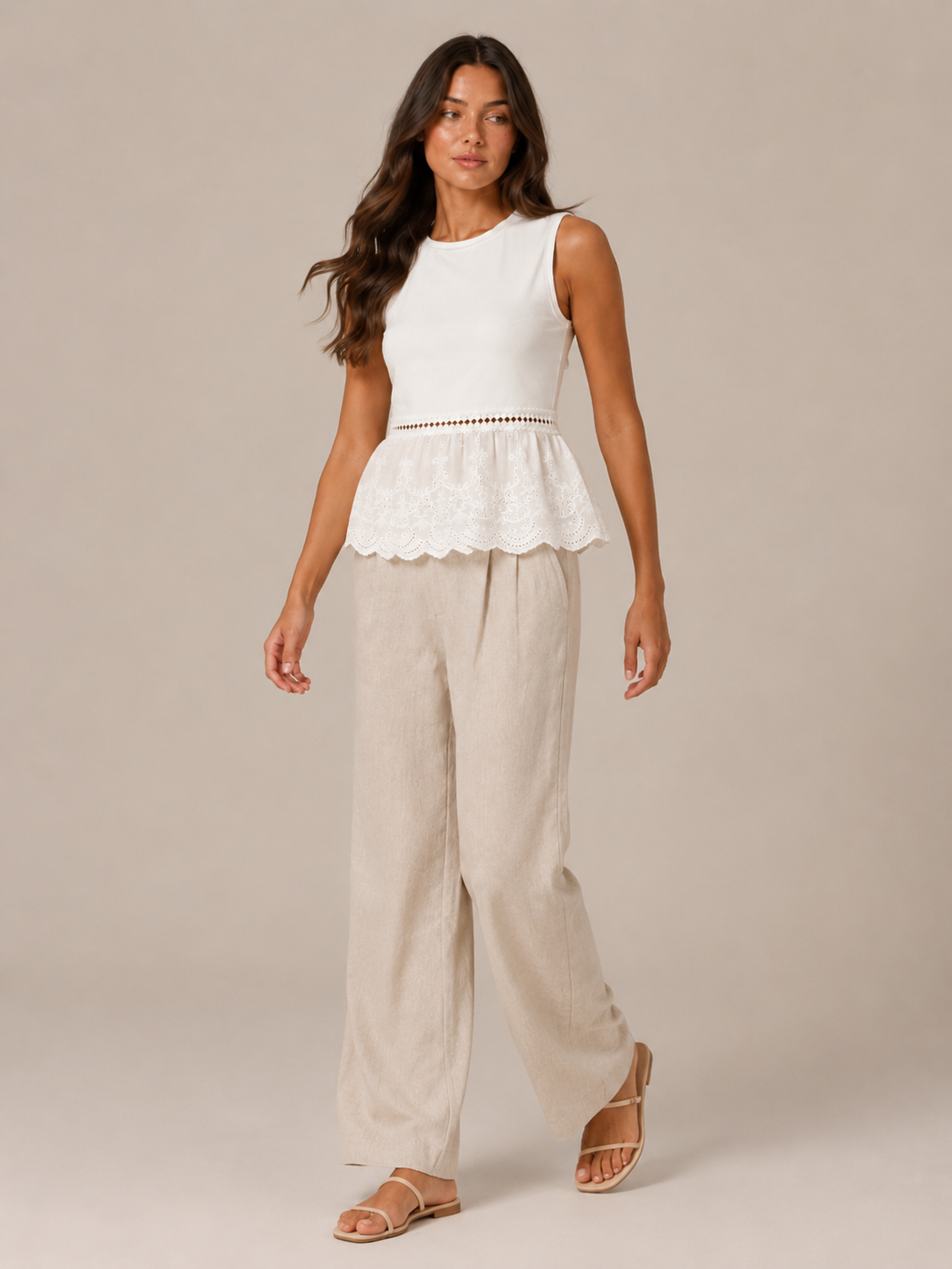 Women's white peplum tank top with lace hem and beige wide-leg linen pants