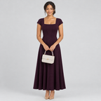 Deep purple square-neck A-line dress on model with cap sleeves and white bag