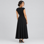 Back view of dark square-neck A-line dress with cap sleeves on model