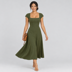 Olive green square-neck A-line dress in motion with tan bag