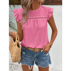 Women's eyelet cap-sleeve blouse in pink with ruffled sleeves and round neckline