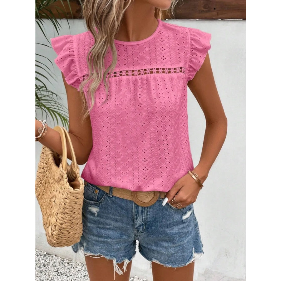 Women's eyelet cap-sleeve blouse in pink with ruffled sleeves and round neckline