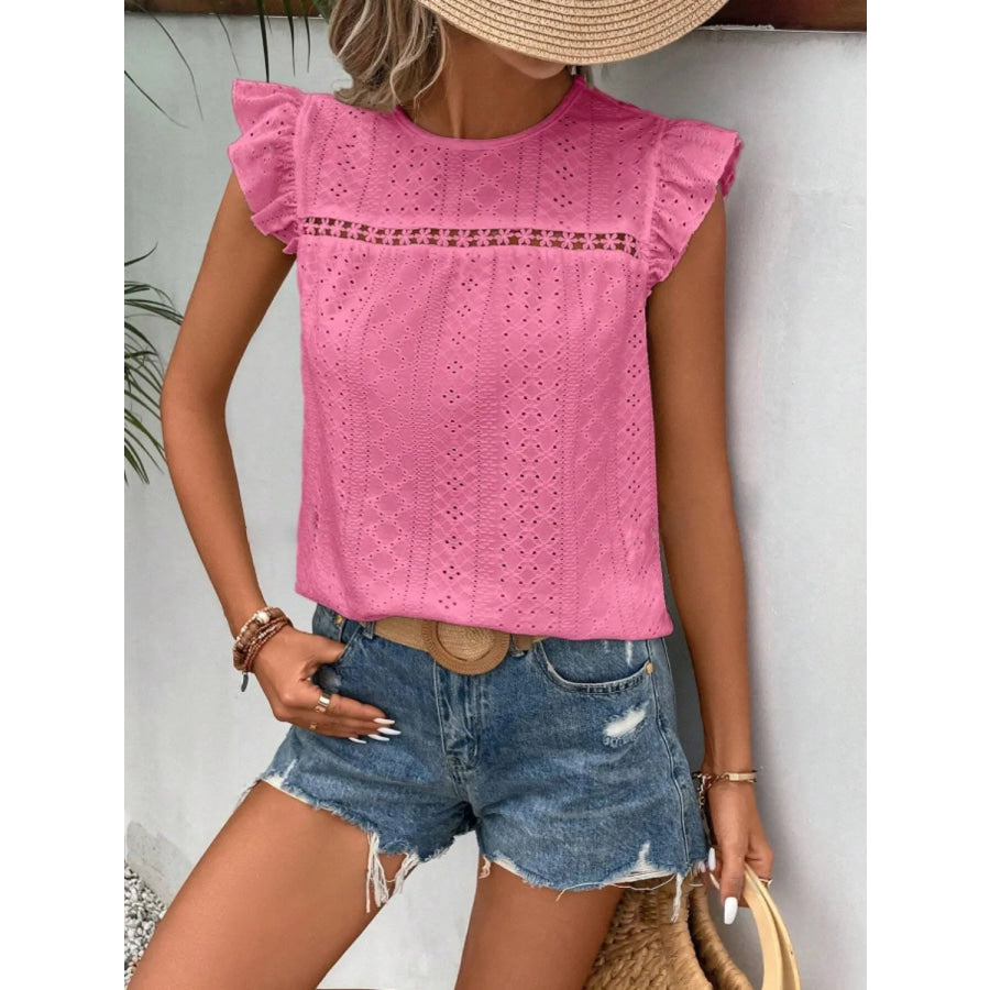 Women's eyelet cap-sleeve blouse in pink, featuring a textured eyelet yoke and ruffle