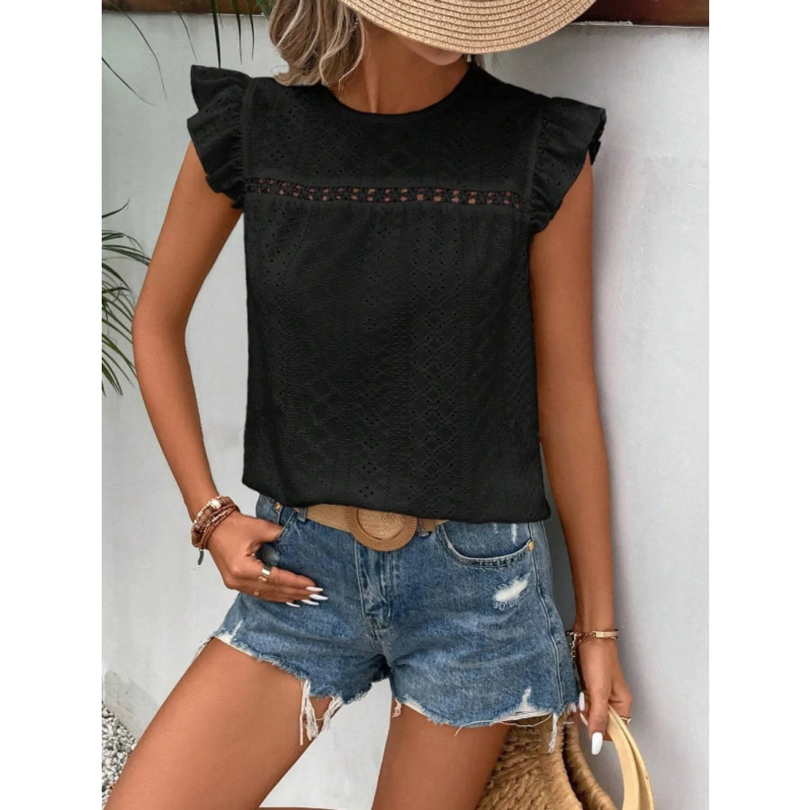 Women's eyelet cap-sleeve blouse in black with ruffled shoulders