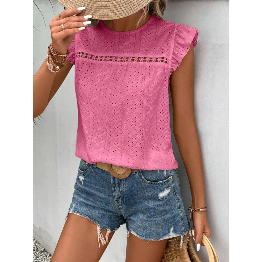 Women's eyelet cap-sleeve blouse in pink with round neckline and all-over eyelet pattern