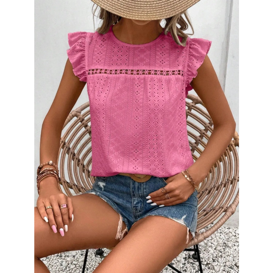 Women's eyelet cap-sleeve blouse in pink with flutter ruffled shoulders and eyelet detail