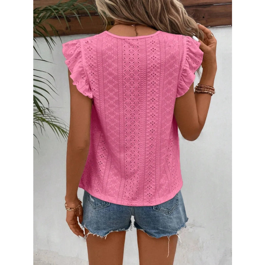 Women's eyelet cap-sleeve blouse in pink, back view with ruffled shoulders