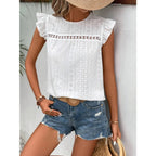 Women's eyelet cap-sleeve blouse in white with textured eyelet panel and ruffled shoulder