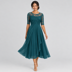 Teal lace bodice midi dress walking view with layered chiffon-look skirt