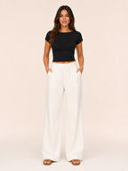 Black short-sleeve crop top with round neckline and smooth, fitted shape