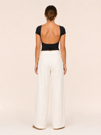 Black short-sleeve crop top with open-back cutout and round neckline