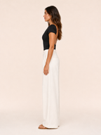 Black short-sleeve crop top with round neckline in a close, fitted style