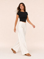 Black fitted crop top with short sleeves and round neckline