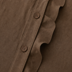 Chocolate-brown sleeveless blouse front placket with buttons and ruffle edge
