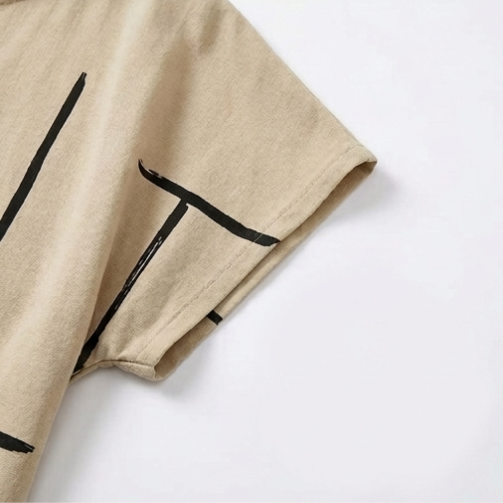 Beige shift dress sleeve detail with black abstract line print