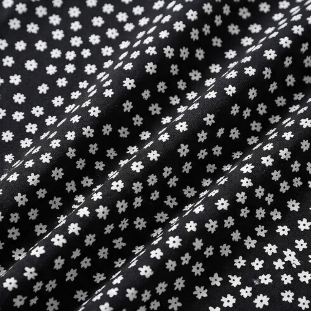 Black fabric with white tiny flower print for smocked wide-leg ruffle trousers