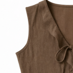 Brown sleeveless blouse neckline with ruffle trim and tied bow detail