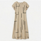 Beige women's shift dress with black abstract line print and short sleeves