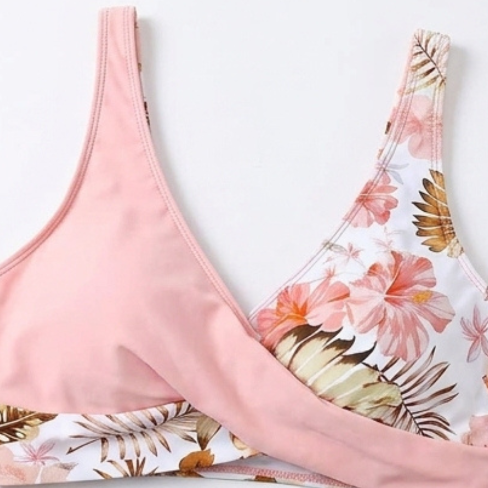 Pink bikini top neckline with floral panel and wrap seam detail