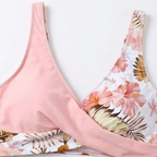 Pink bikini top neckline with floral panel and wrap seam detail