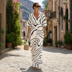 Women’s white and black abstract print V-neck wide-leg jumpsuit with cinched waist