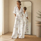 Women’s white floral V-neck wide-leg jumpsuit with cinched waist