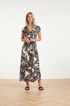 Women's black maxi dress with off-white leaf print, wrap V-neck and gathered waist tie